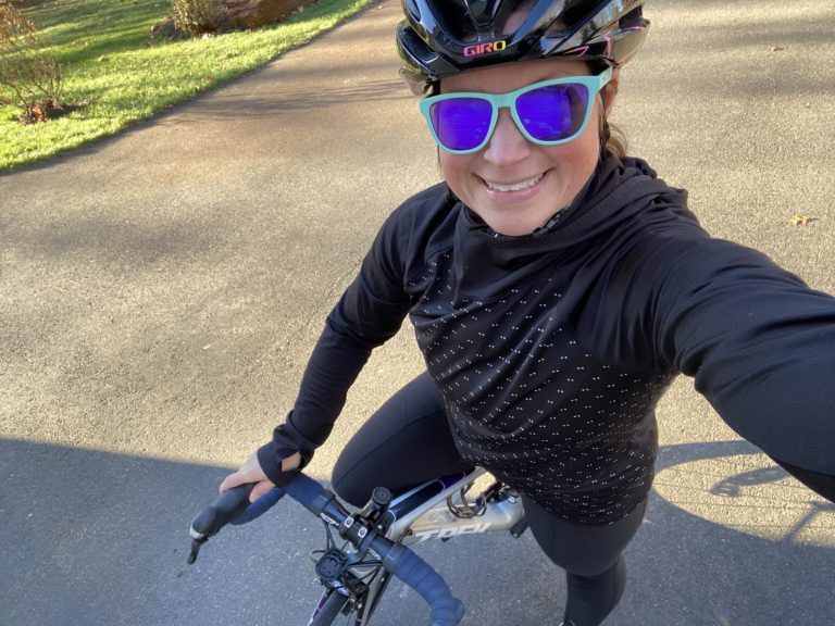 Stacy on Bike Goodr Glasses