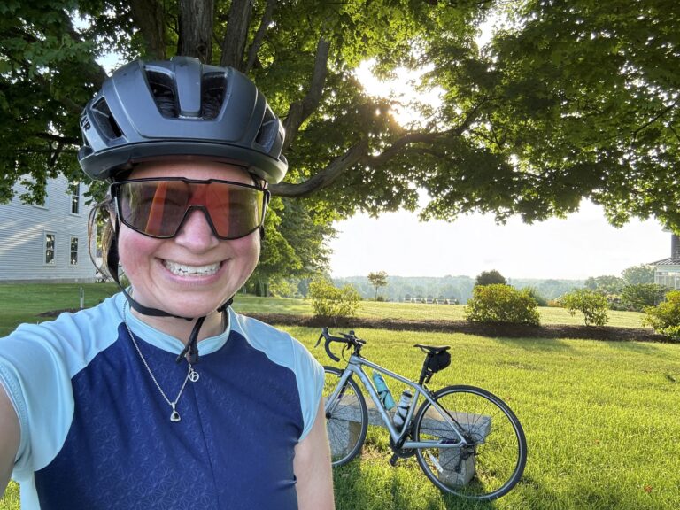 Photo of me with my bike and a view